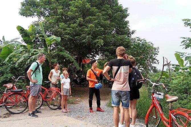 Group of tourists on vintage bicycles in Hanoi