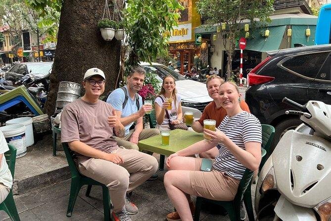 Group of tourists on walking food tour in Hanoi Old Quarter