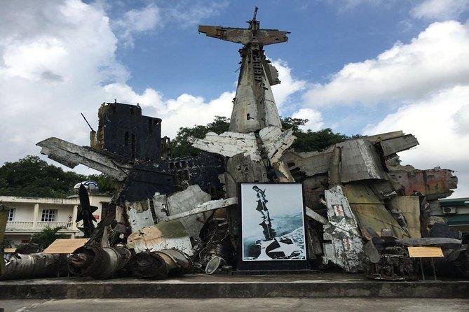 Tourists exploring a war memorial site in Hanoi