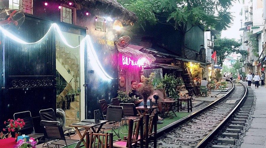 Hidden cafe entrance down a narrow alley in Hanoi Old Quarter