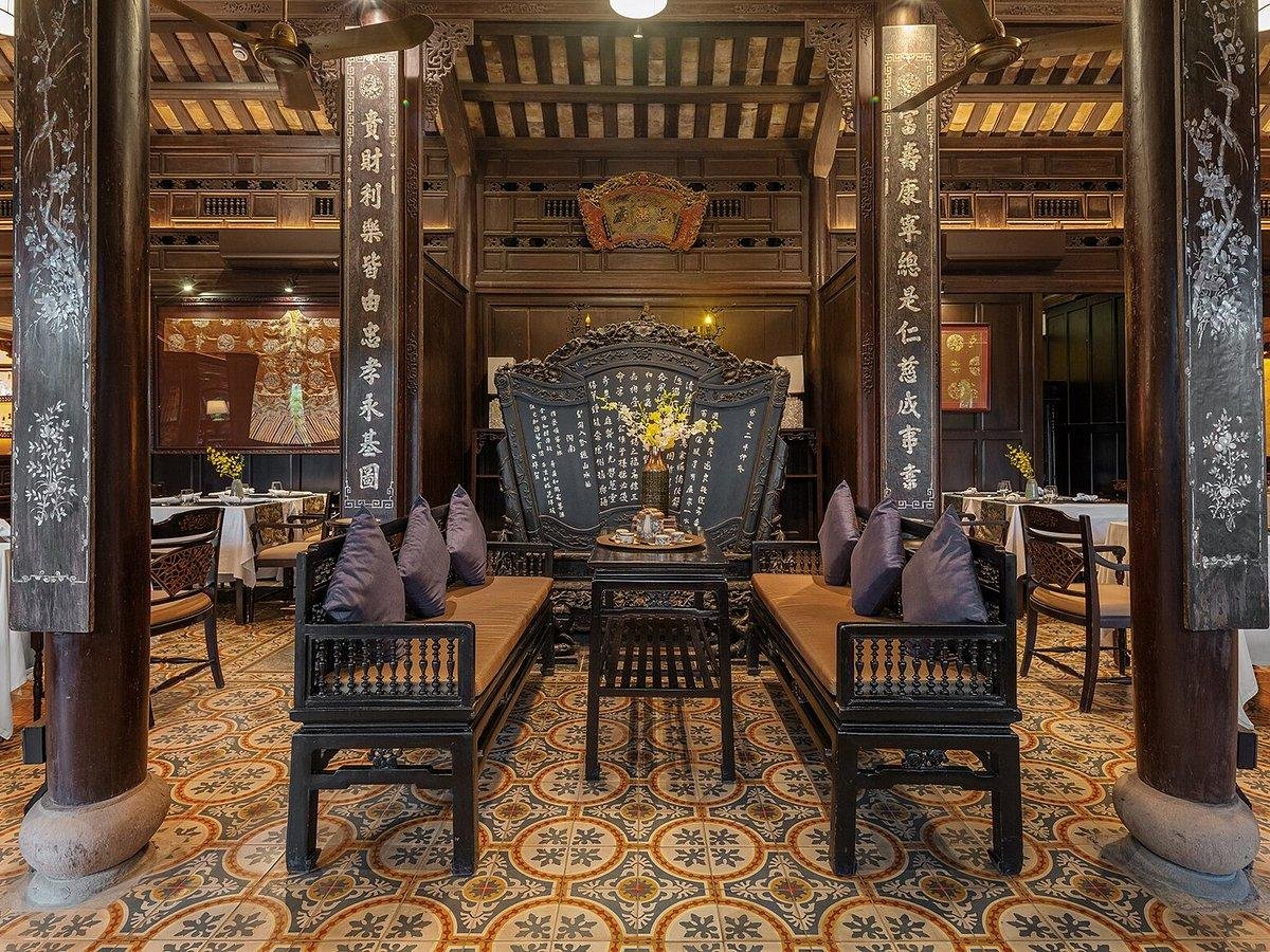 Elegant interior of Home Restaurant showing colonial architecture and traditional Vietnamese decor