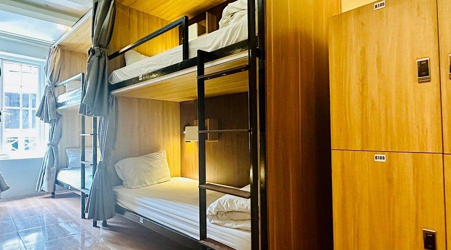 Modern pod-style beds in a Hanoi backpacker hostel