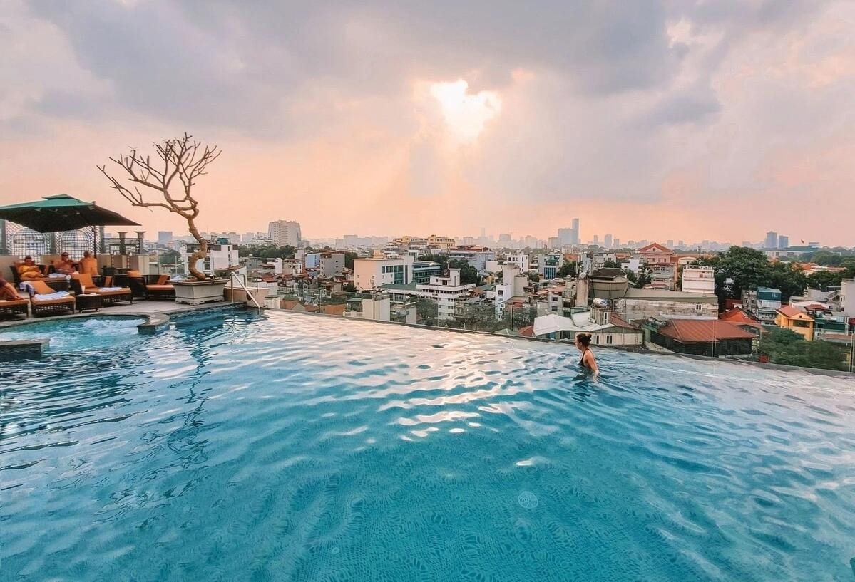 Rooftop pool at a luxury hotel overlooking Hanoi Old Quarter