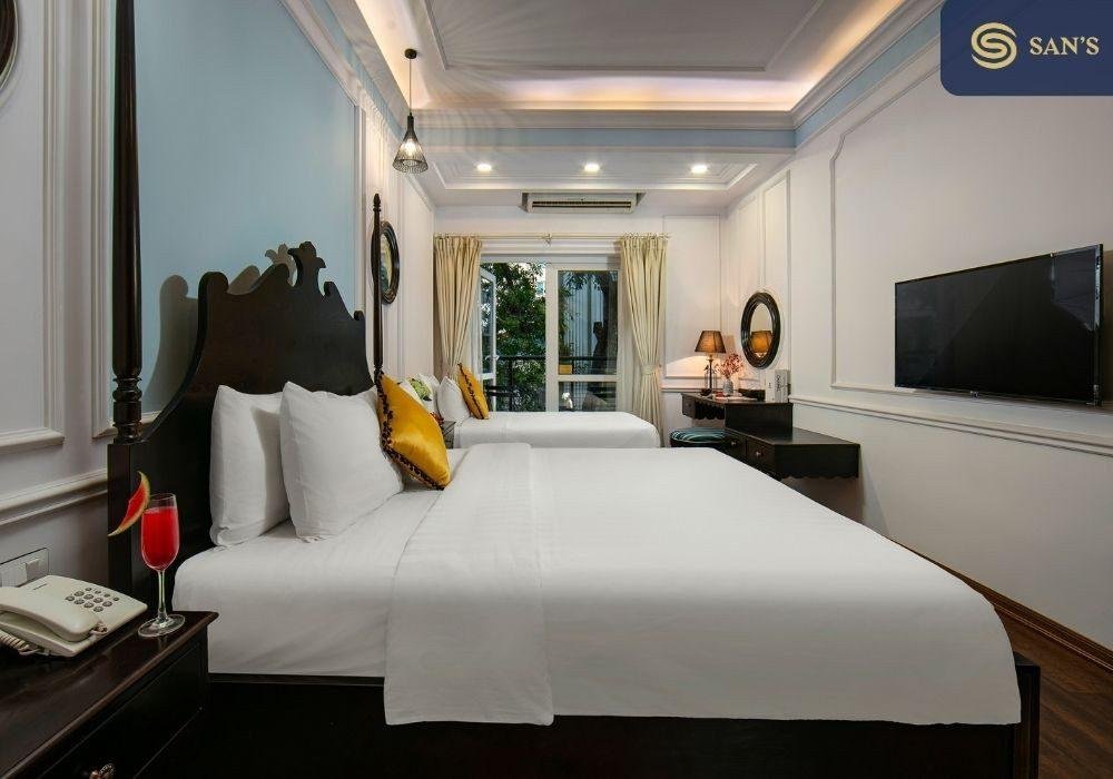 Typical mid-range hotel room in Hanoi Old Quarter featuring comfortable furnishings