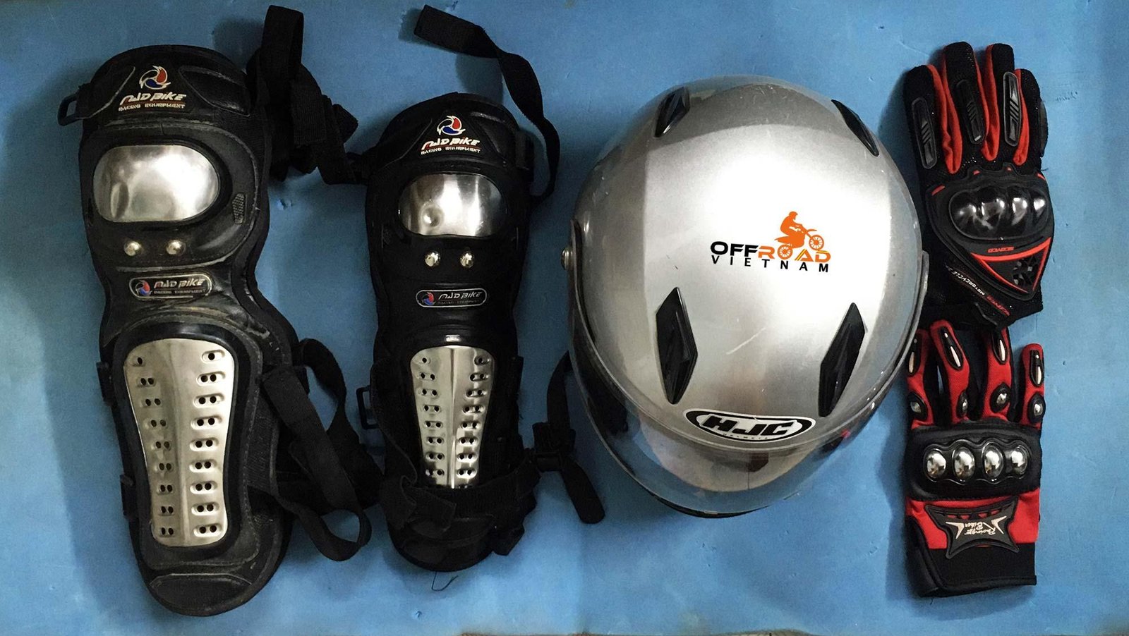 Essential motorbike safety gear including helmet, gloves and protective clothing