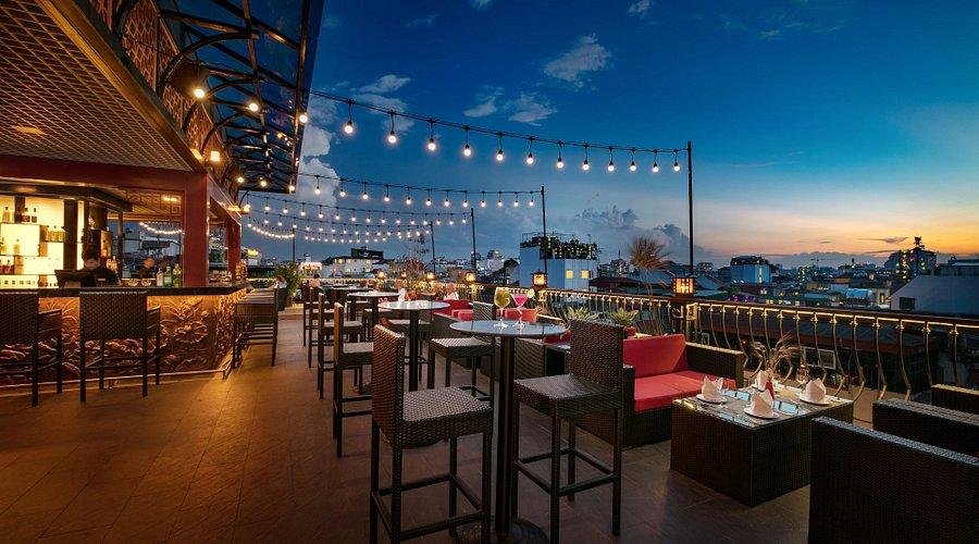 Rooftop dining with a view of Hanoi Old Quarter at sunset