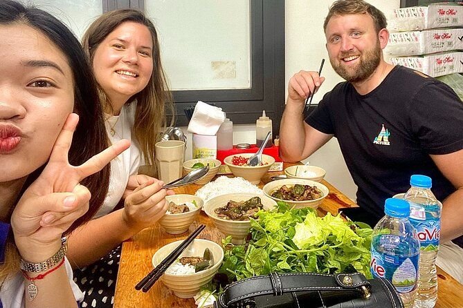 Professional guide ensuring child safety during Hanoi food tour