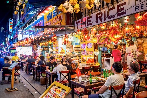 Busy street food scene in Ho Chi Minh City at night