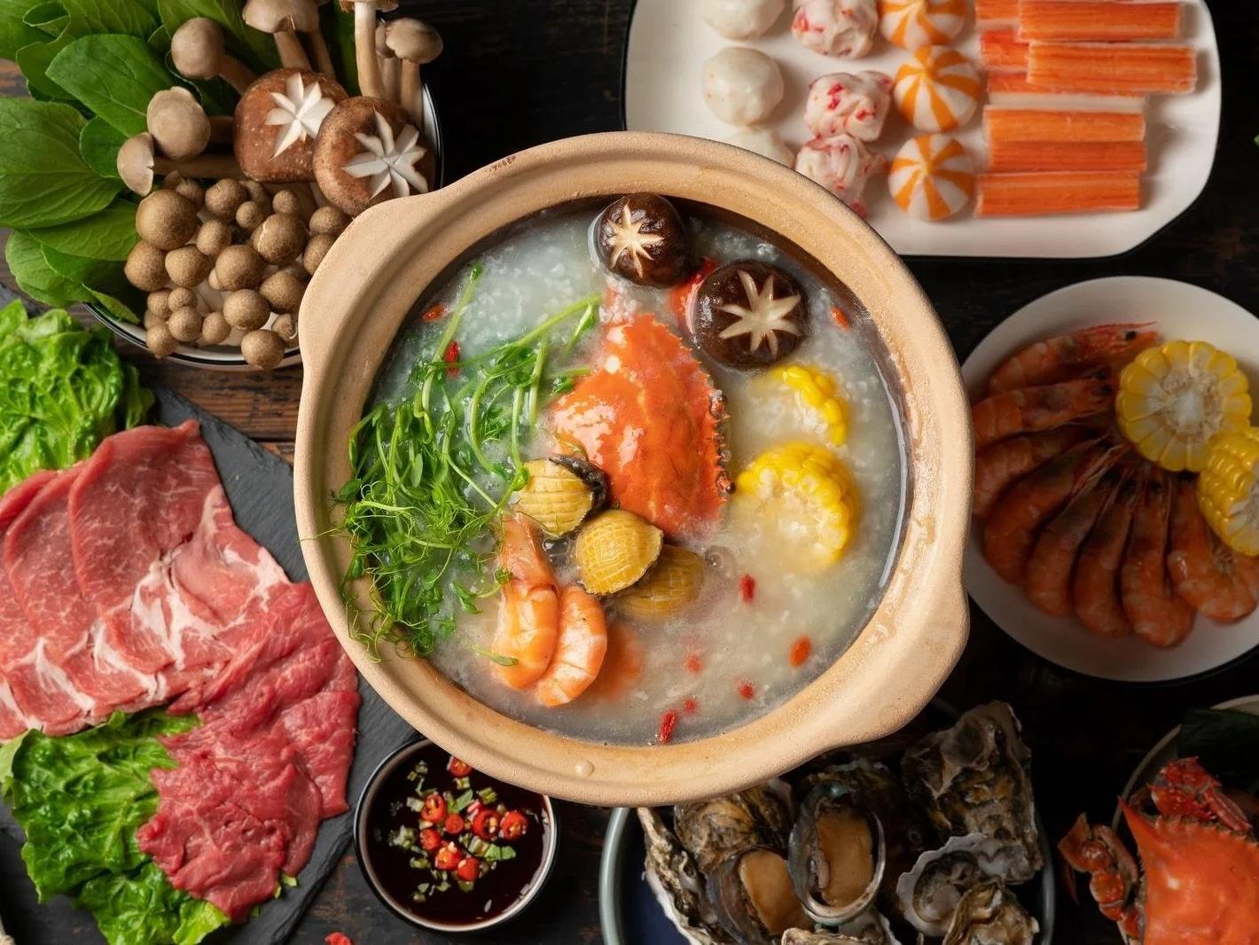 Bubbling seafood hotpot with fresh herbs and diverse seafood