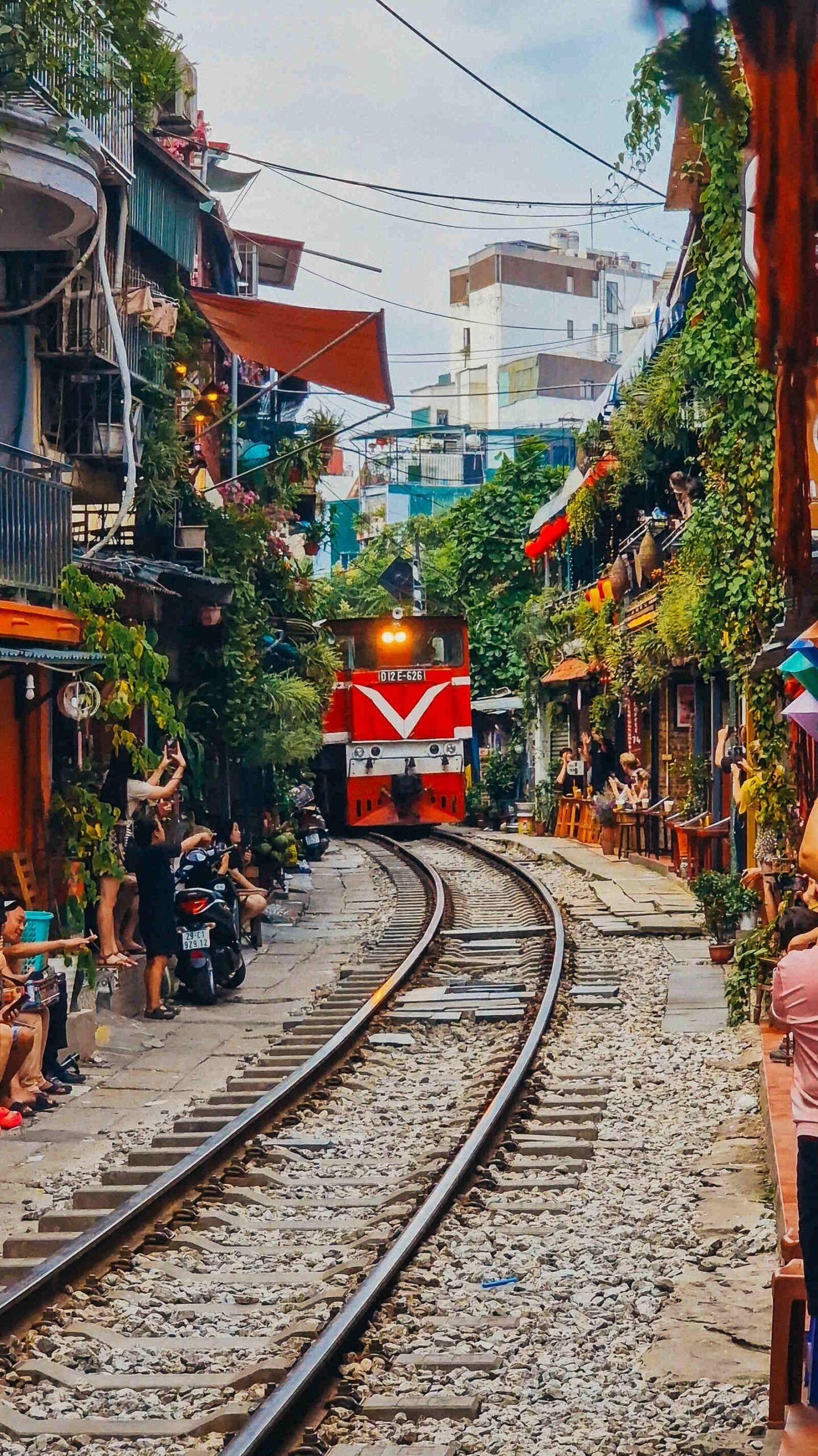 Famous Train Street in Hanoi with railway track running between buildings