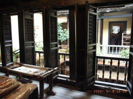 Interior courtyard of a traditional tube house in Hanoi Old Quarter showing architectural details