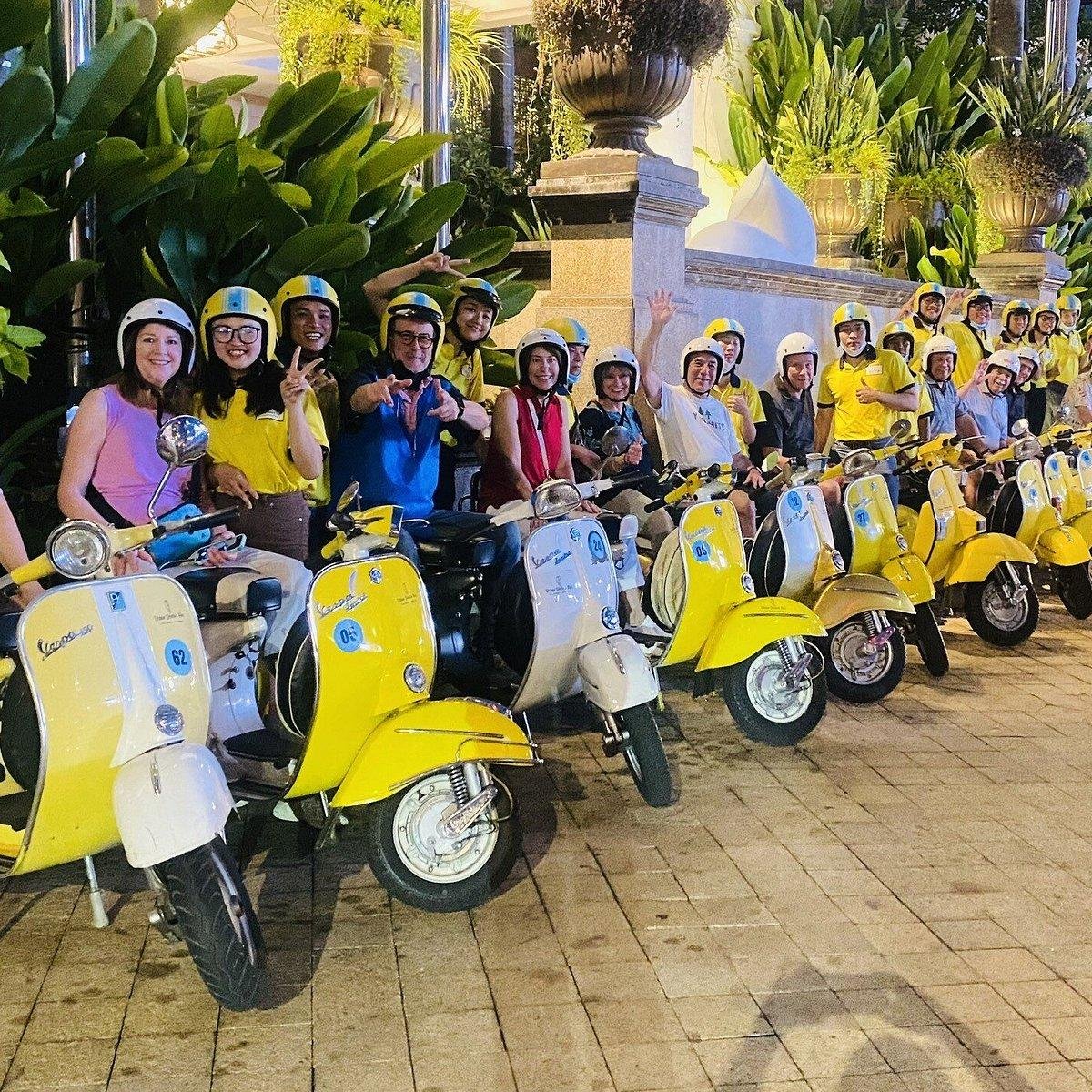 Safety equipment and well-maintained Vespa scooters ready for tour