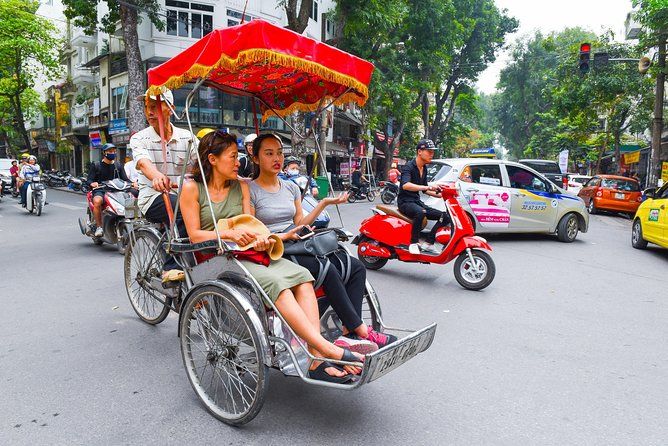 Small group enjoying bike food tour with Vietnam Travelers guide