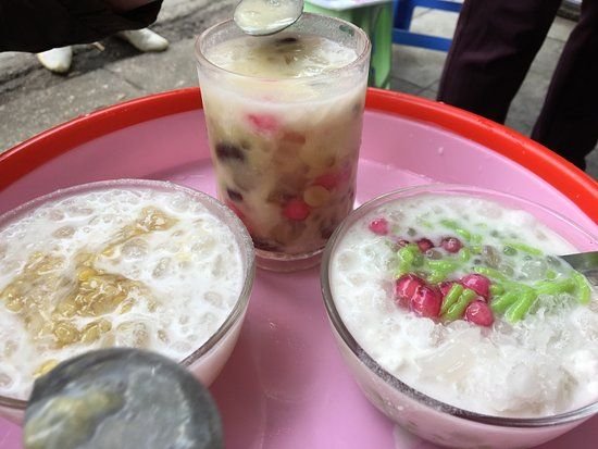 Colorful array of Vietnamese che desserts in glass containers