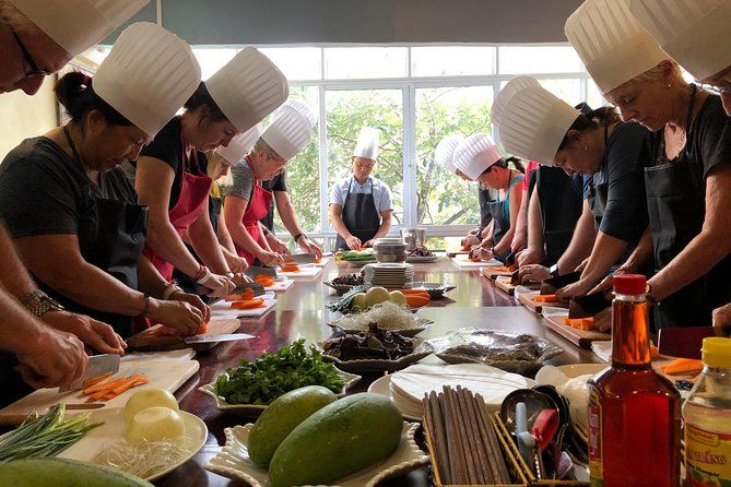 Tourists participating in Vietnamese cooking class in Hanoi