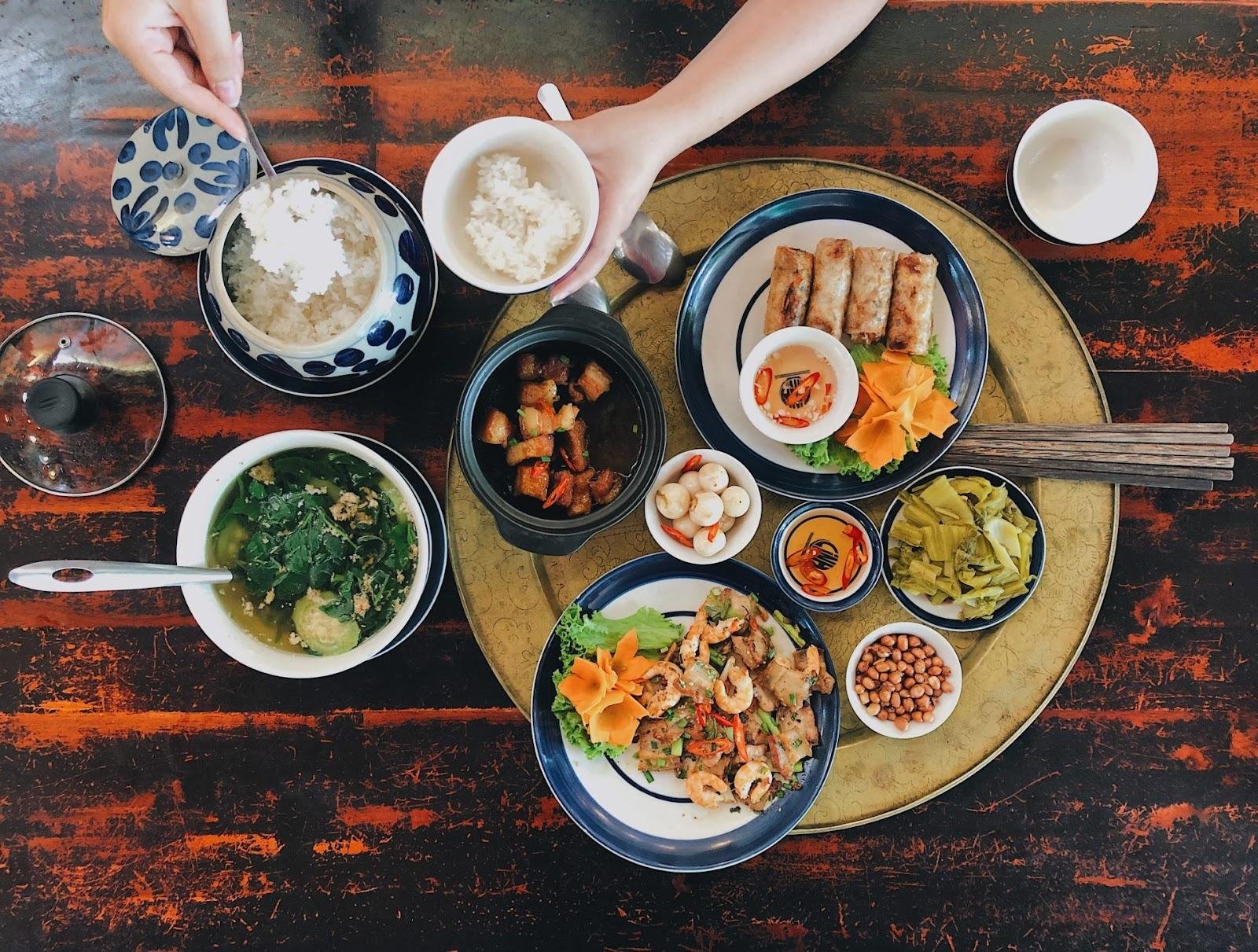 Family-style Vietnamese meal with multiple shared dishes