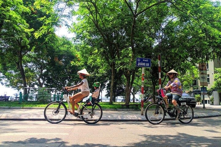 E-biker enjoying scenic views of West Lake in Hanoi
