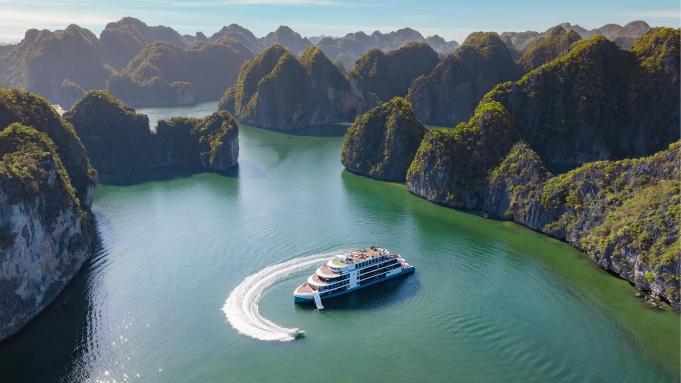 Private guests kayaking through Ha Long Bay limestone scenery