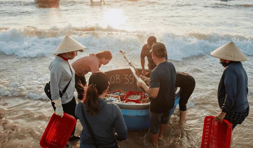 Tourists are delighted to see fishing boats docking at the shore every early morning