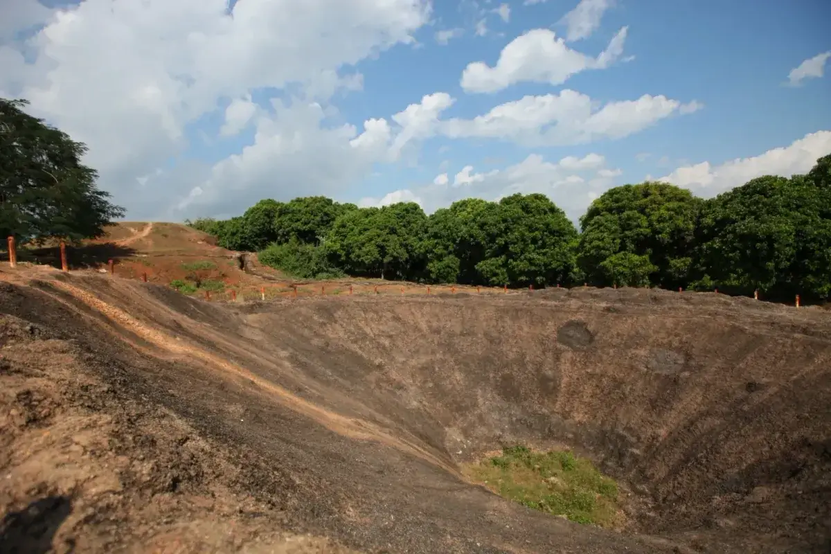 Large explosion crater and preserved battlefield remains on A1 Hill in Dien Bien Phu