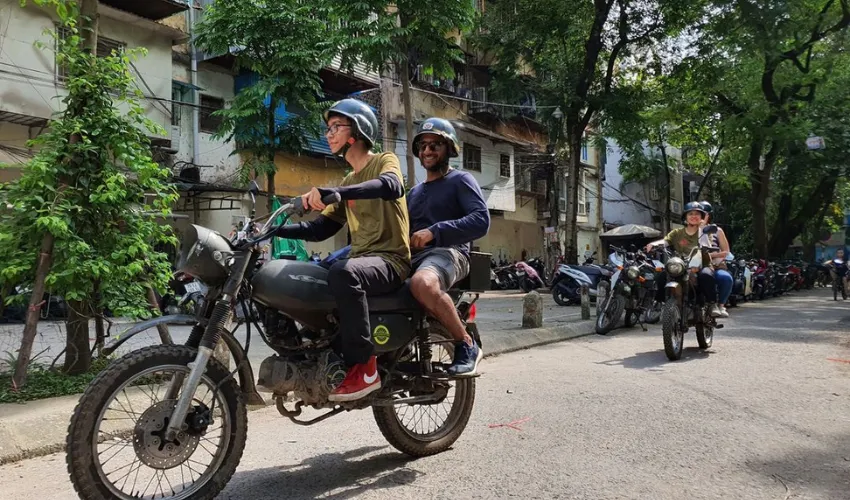 Riding on the back of a motorbike offers tourists many fresh perspectives on old Hanoi