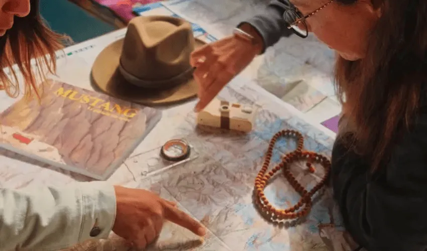 Travelers planning a Vietnam Cambodia and Laos itinerary on a map