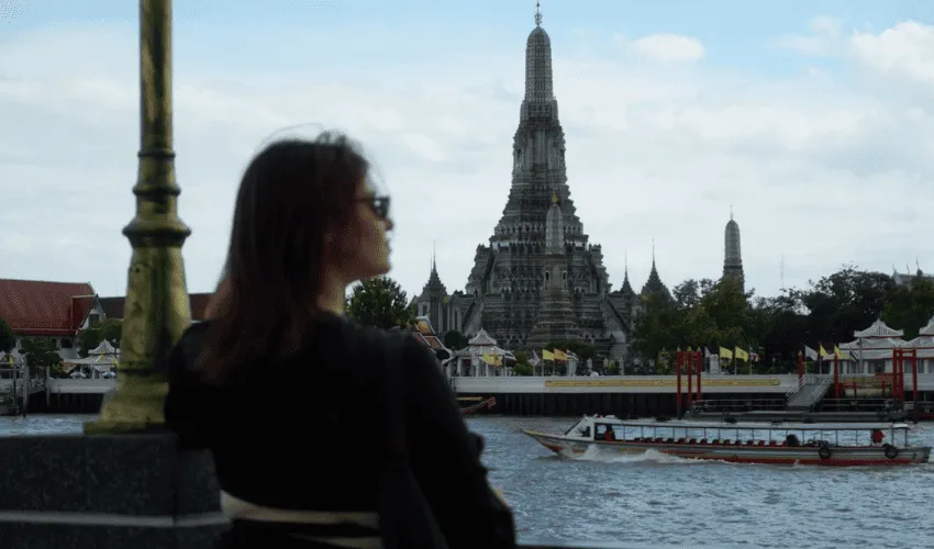 Traveler viewing Wat Arun in Bangkok on a Thailand tour package