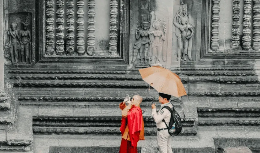Private guide accompanying a traveler at Angkor Wat Cambodia