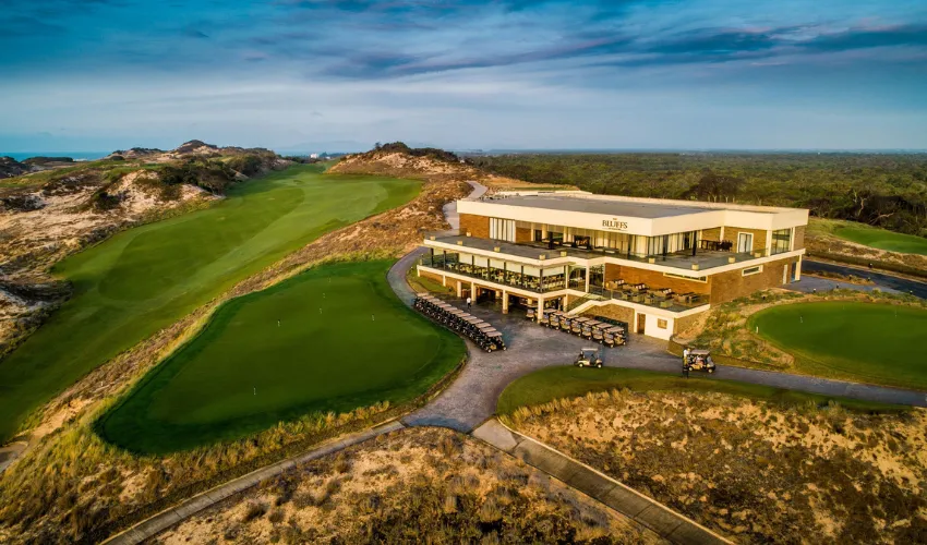 Golf carts and premium clubhouse facilities on a private golf tour in Vietnam